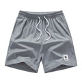 Men's black drawstring summer shorts with straight legs and micro-elastic polyester fabric