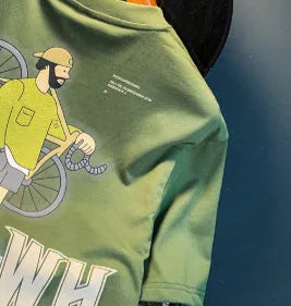Green loose fit men's short sleeve t-shirt with a printed graphic design on the front.