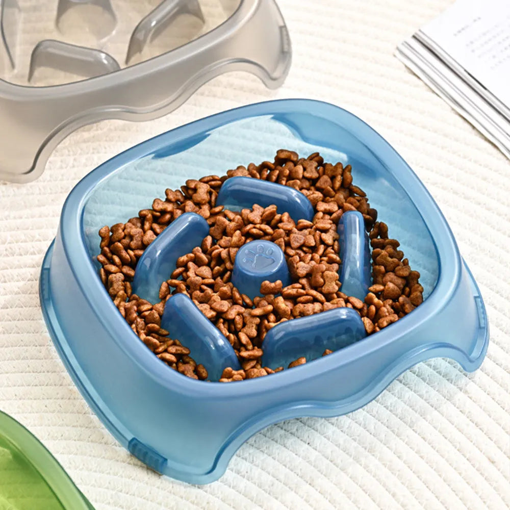 Blue plastic dog slow feeder bowl with internal maze pattern for portion control.