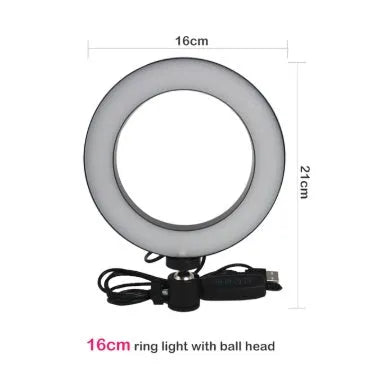 Black 20cm LED ring light kit with tripod, selfie stick, and phone clip on a desk