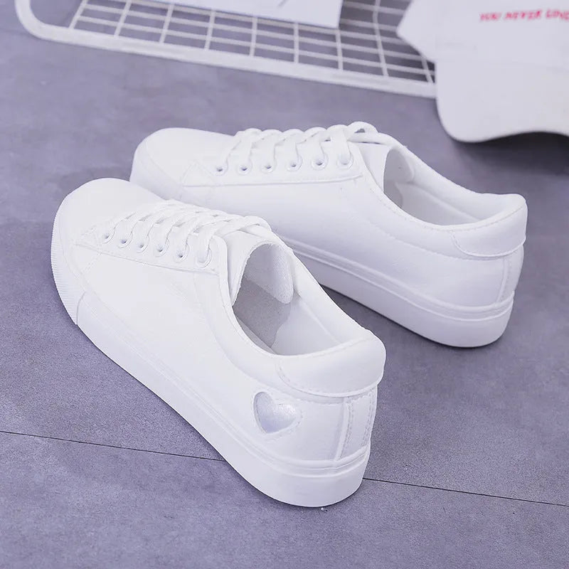 Women's PU leather heart flats shoes with colourful beads and stainless steel pendant on white background