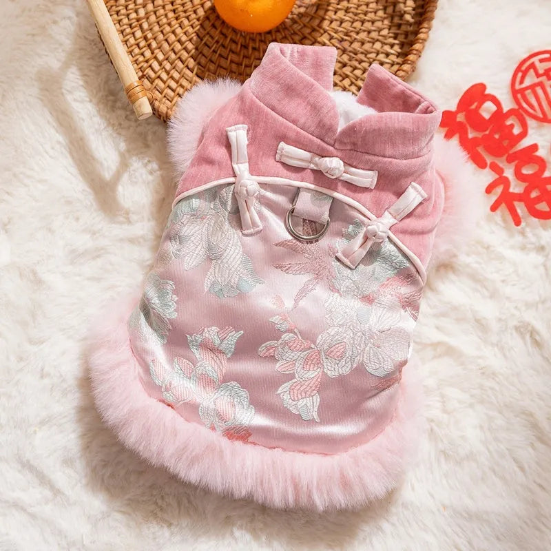 Chinese-style pet Tang Suit jacket in red with stand-up collar and fluffy trim on small dog