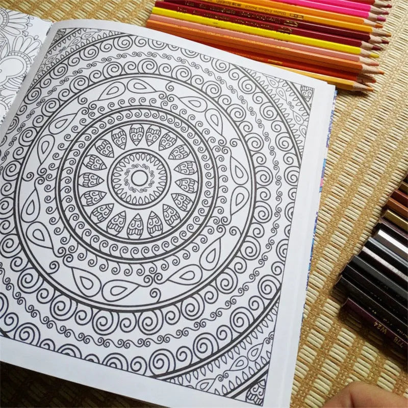Square mandala colouring book open to show geometric patterns, with soft binder cover.