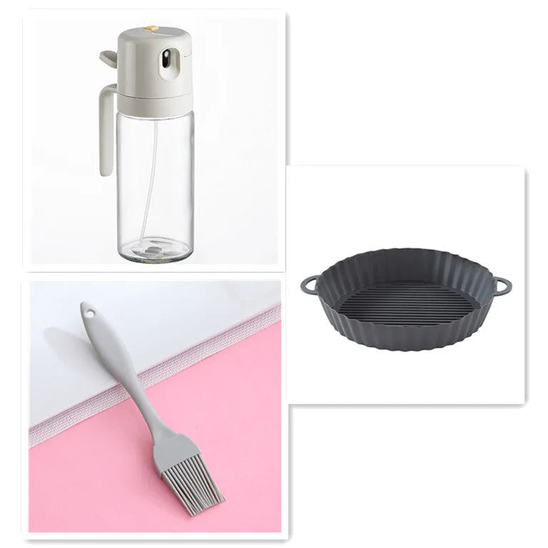 Warm grey glass oil spray bottle with a black lid and switch for selecting spray or pour mode.