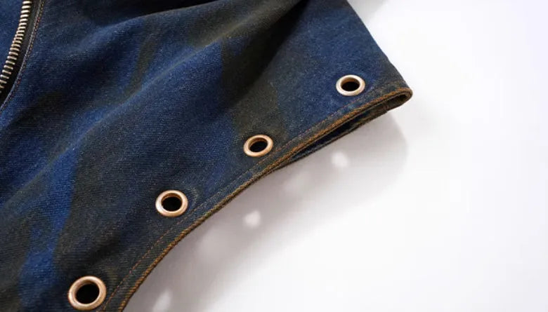 Blue hooded denim vest coat and matching trousers laid flat.