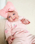 Infant wearing a printed long-sleeve top, solid trousers, and matching cap from the 3-piece suit set.