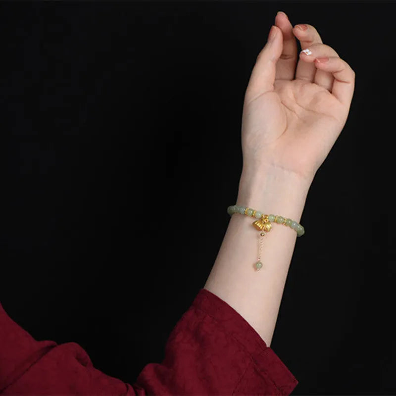 Natural Hetian jade bracelet with lotus carving and fu symbols on 6mm beads