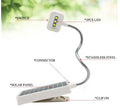 White solar garden lamp with plastic shade and integrated solar panel for outdoor decorative lighting.
