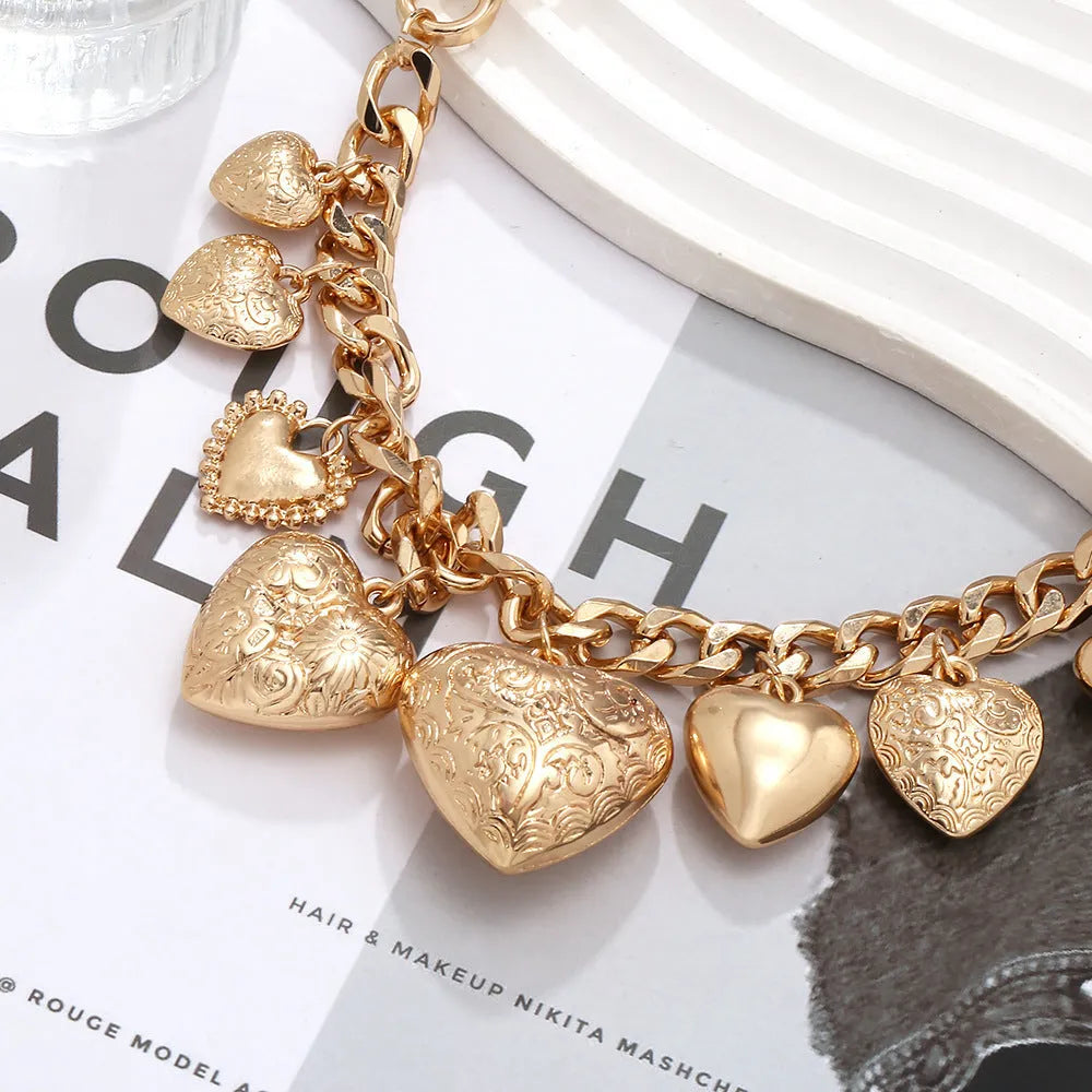 Carved heart pendant necklace in alloy metal with adjustable chain length between 41cm and 50cm