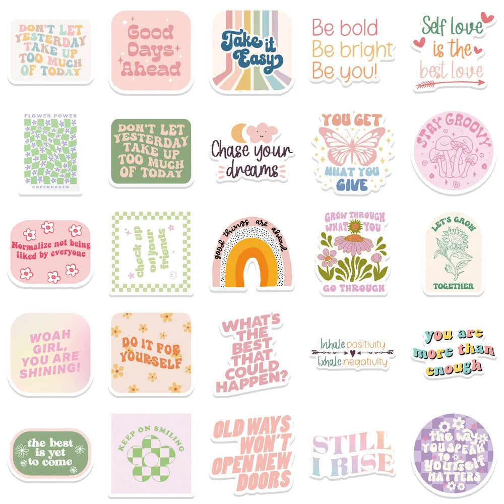 Danish pink motivational statement stickers with graffiti and cartoon designs on a laptop.