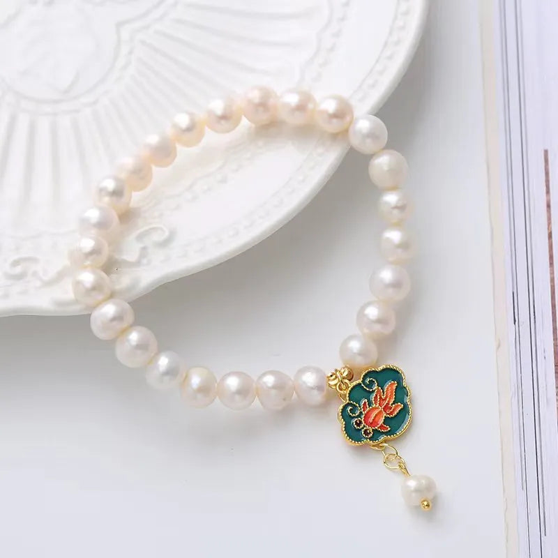 White antique bracelet with freshwater pearl and goldfish lotus pendant