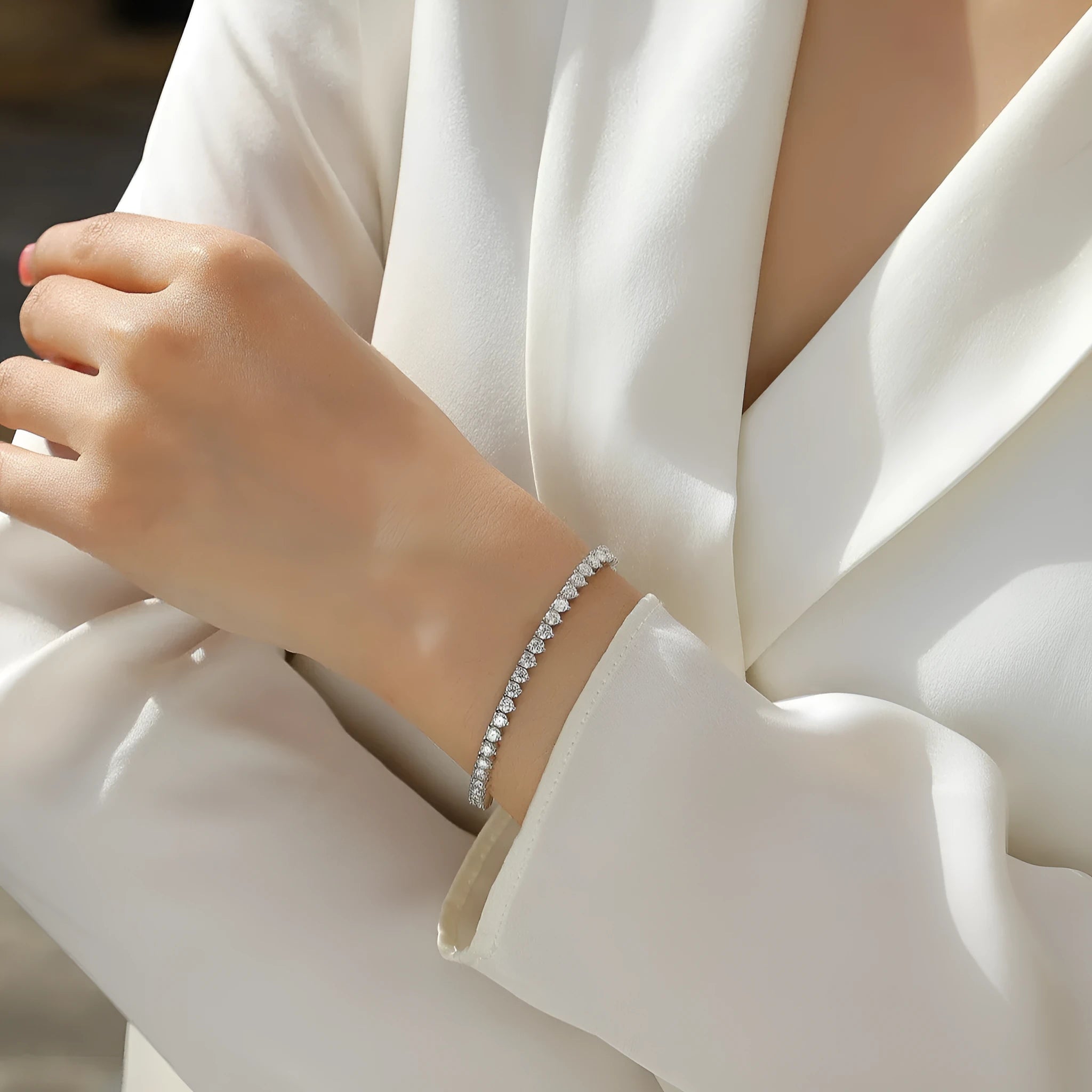 Silver platinum-plated moissanite bracelet with round-cut stones on a white background