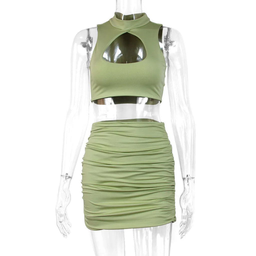 Light purple women's two-piece set with hollow vest top and split skirt on model