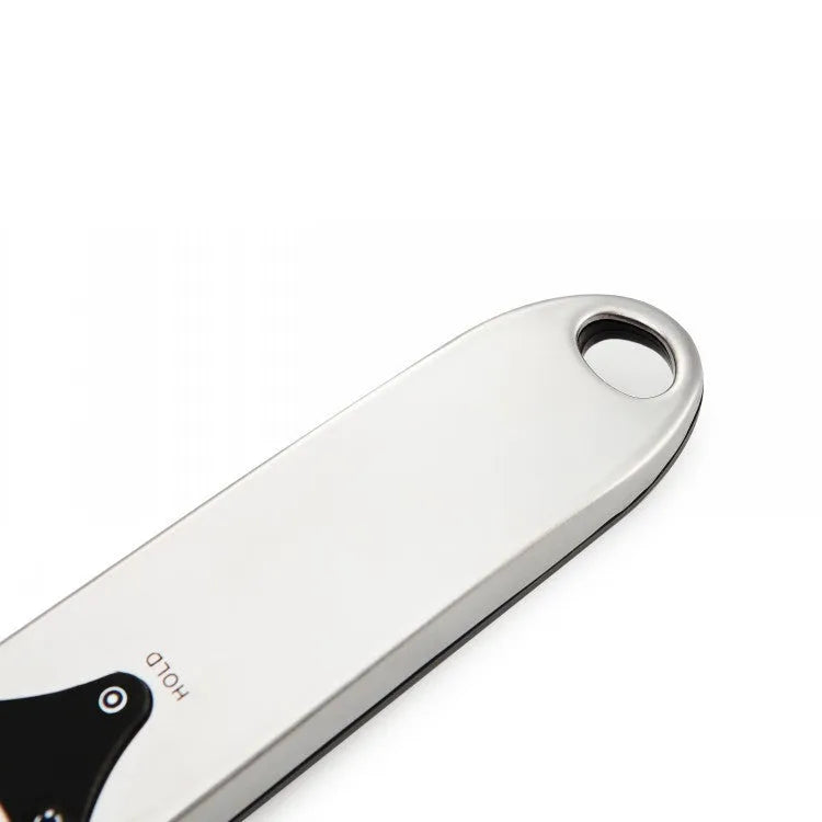 Digital kitchen measuring spoon with LCD screen showing weight measurement