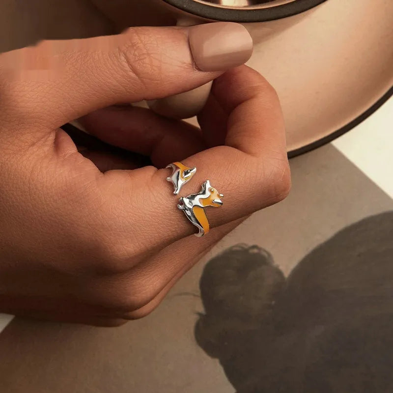 Silver electroplated cartoon corgi fashion ring for women on a white background.