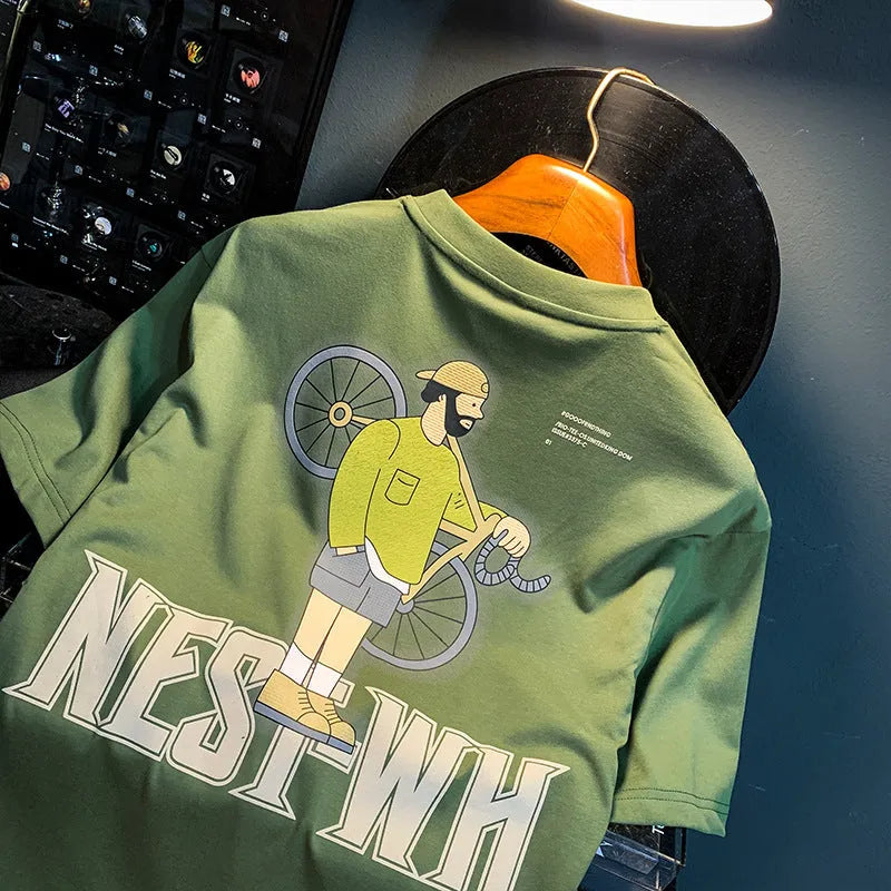 Green loose fit men's short sleeve t-shirt with a printed graphic design on the front.