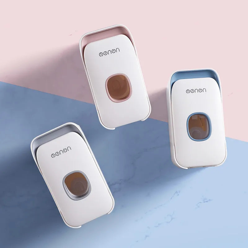 Automatic wall-mounted toothpaste dispenser in blue, grey, or pink colours