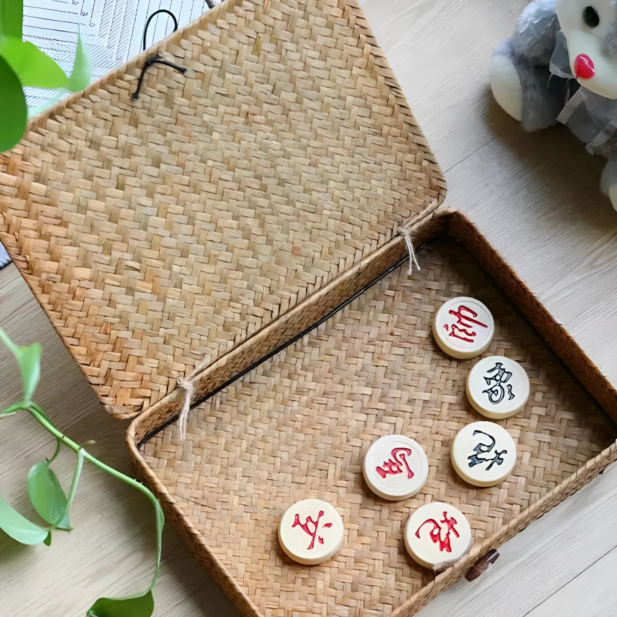 Handwoven natural straw storage box on a wooden desktop, size 32x28x7 cm, in coffee colour