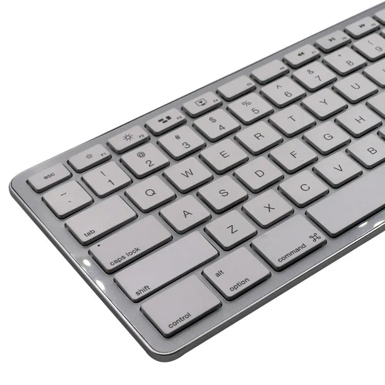 White 109-key wireless Bluetooth keyboard on a desk, showing three-key zone layout.