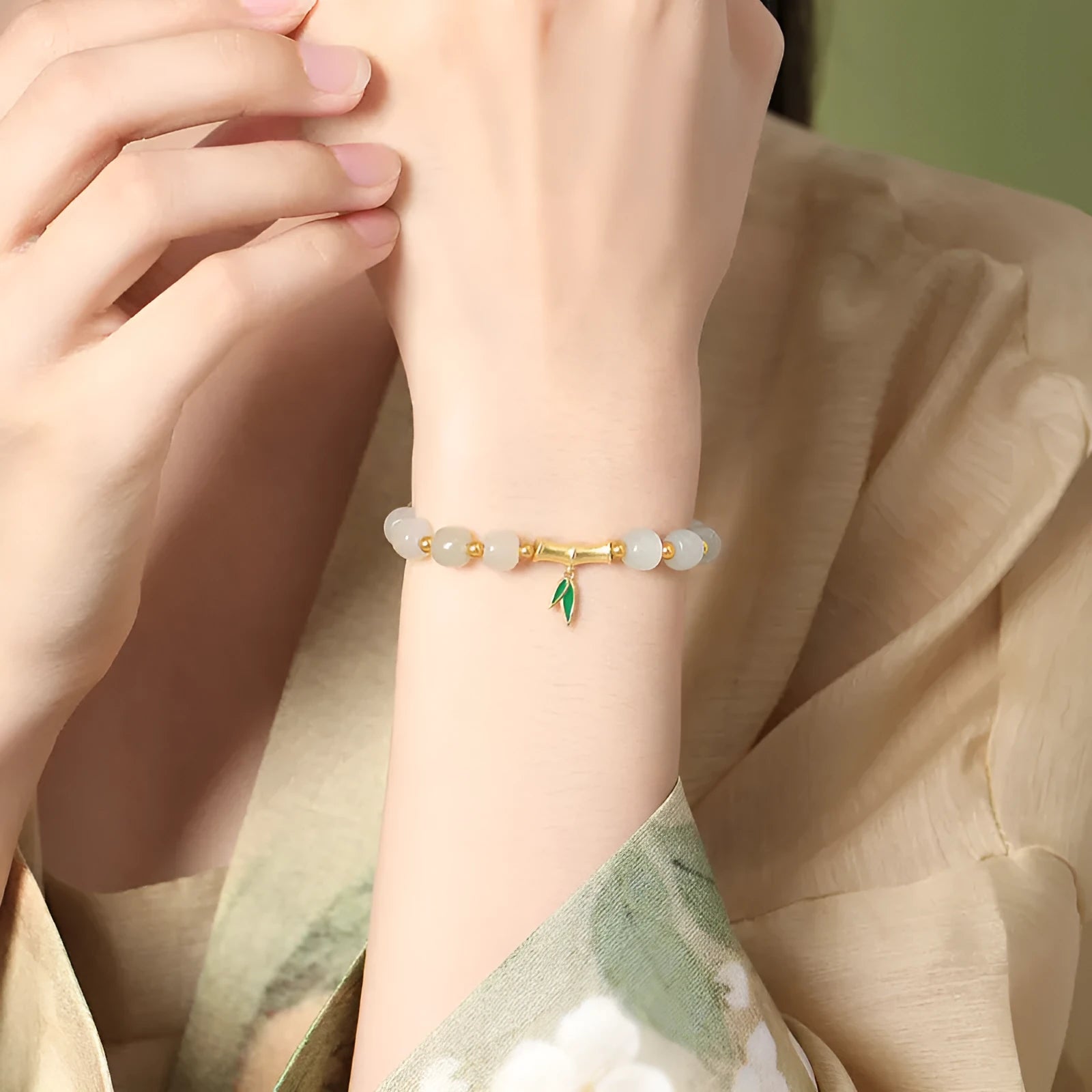 Gold Zhizhu Hetian jade bracelet with 925 silver and 6mm leaf-shaped beads in bamboo design