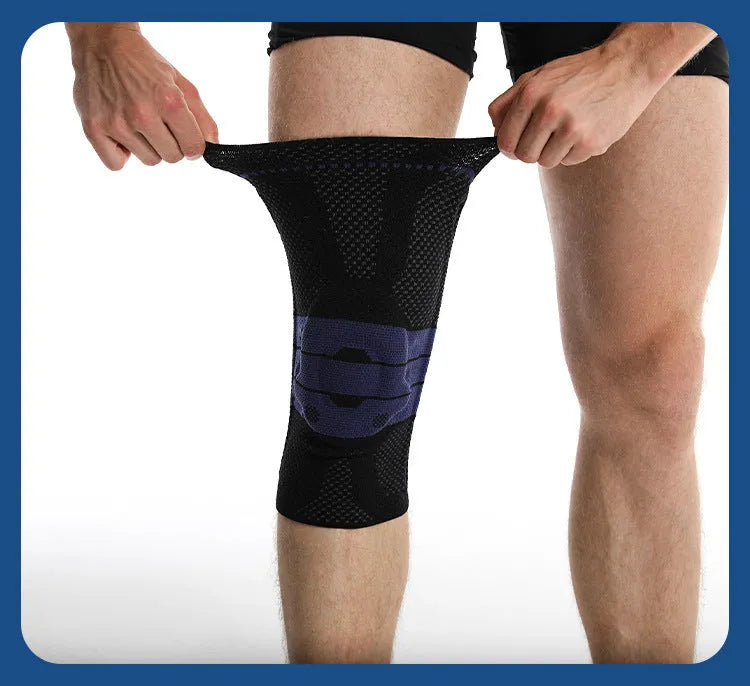 Adult sports knee pad in black and blue colour, made from nylon and spandex, shown on a knee.