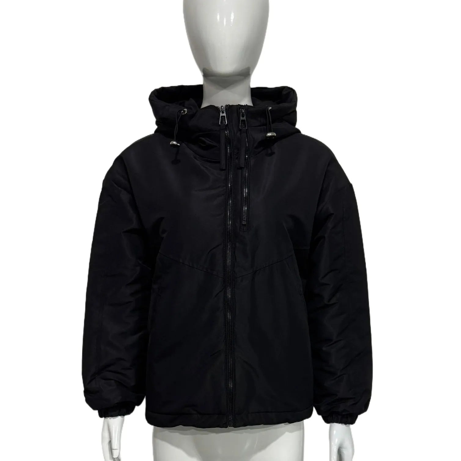 Grey women's loose-fit hooded polyester shell jacket with long sleeves on a hanger.
