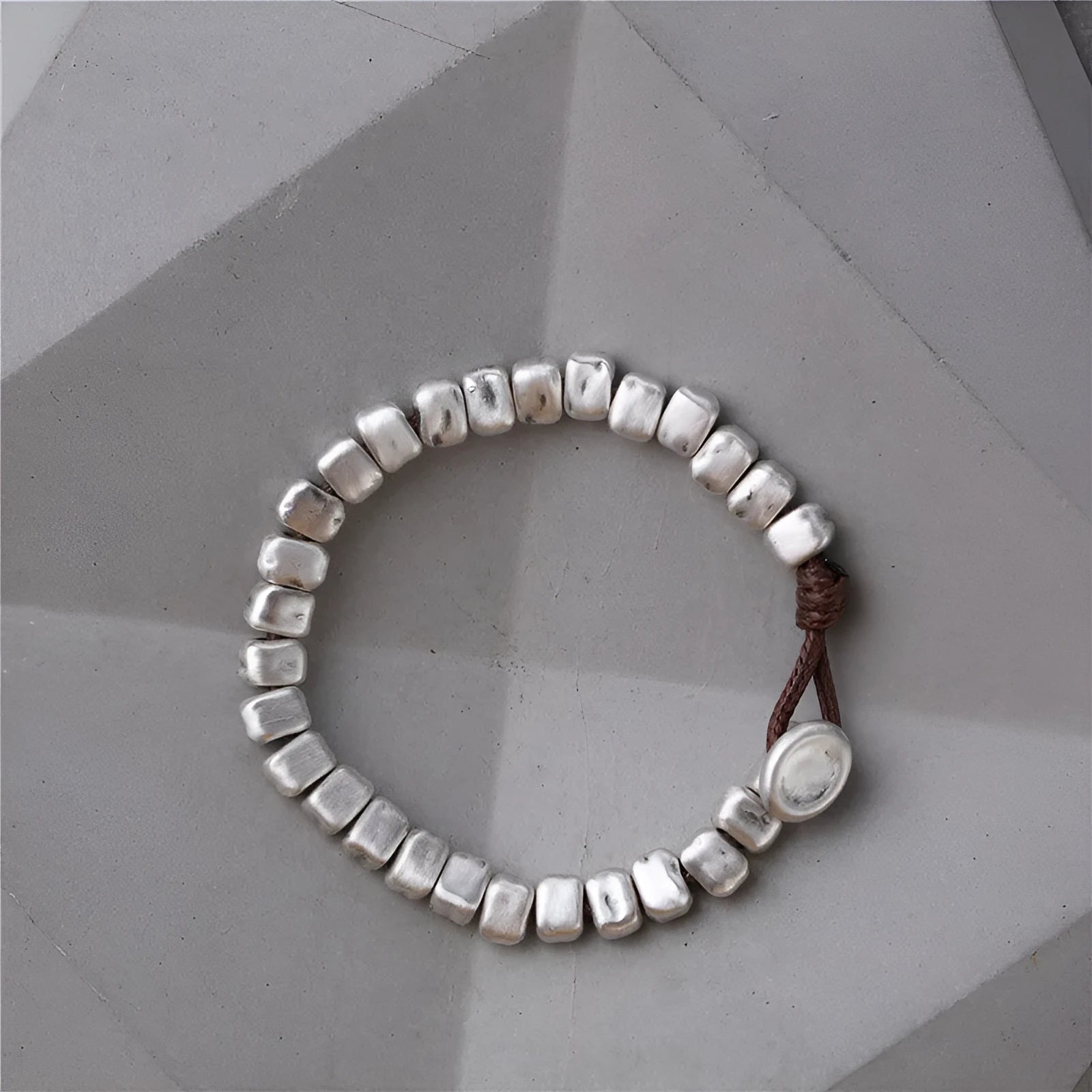 Women's handmade silver bracelet with wooden irregular square design on elasticated band