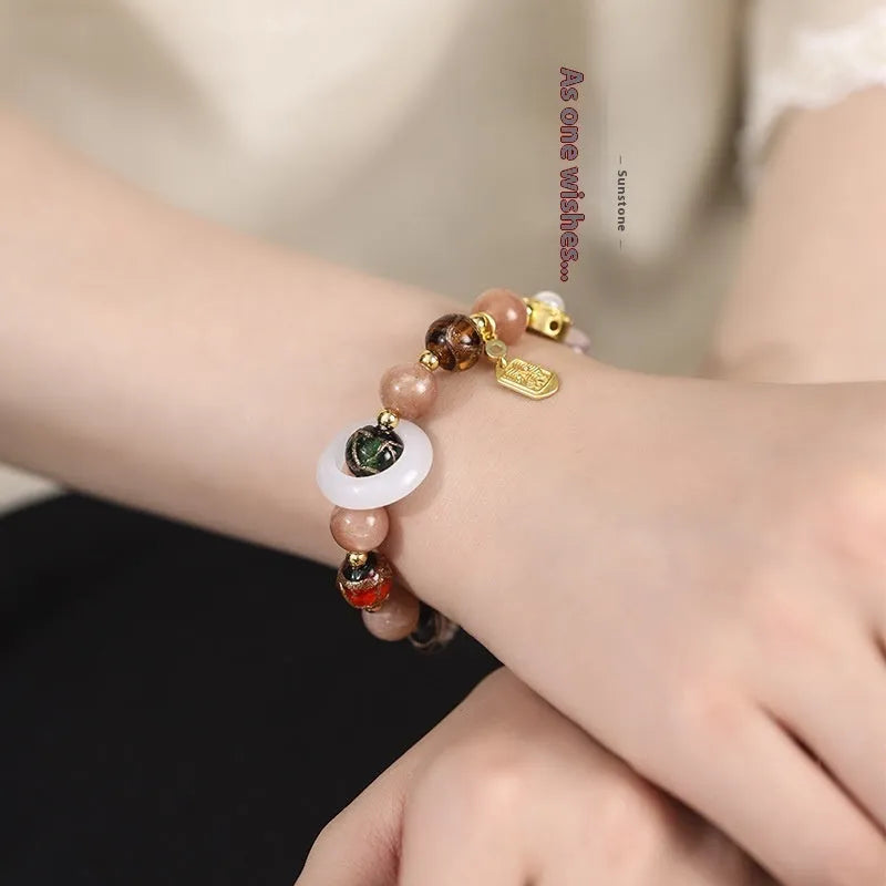 Hand-woven fragrant grey coloured glaze bracelet with natural stone beads on wrist