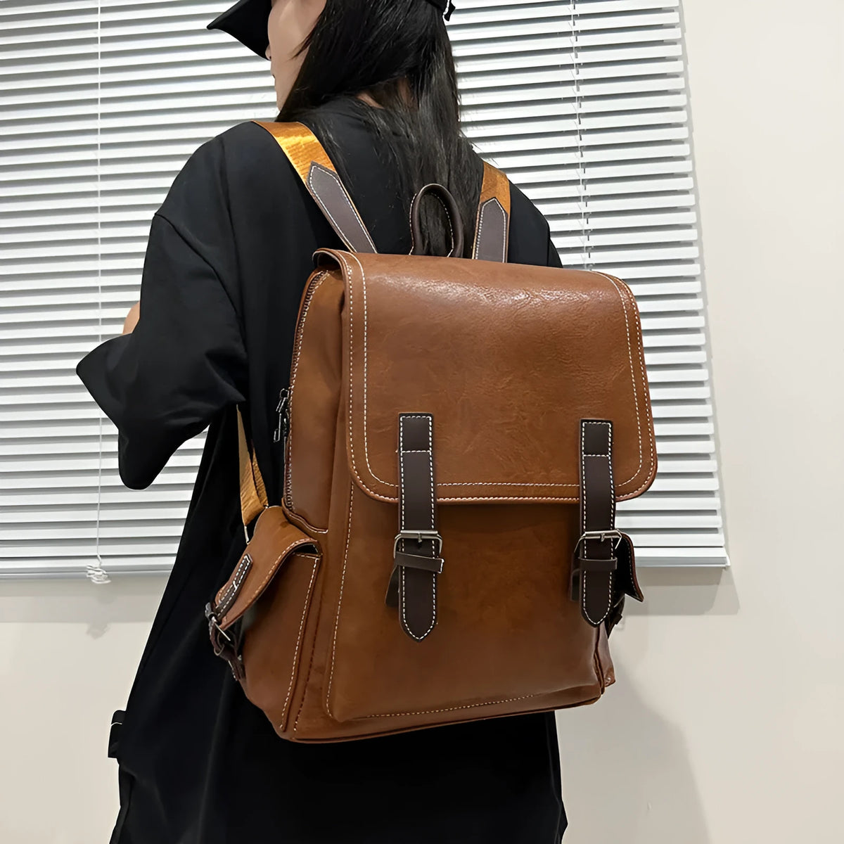 Retro leather travel backpack in black, dark brown, or brown with curved shoulder straps and 20-35L capacity