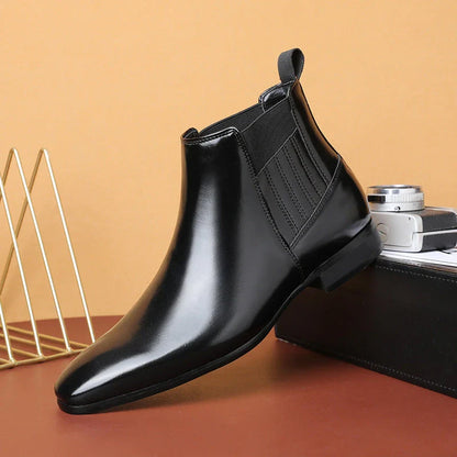 Stylish pointed-toe Chelsea boots for men in black and brown colors, featuring a square heel and sleek, British-inspired design.