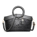 Fabric casual handbag for women showing multiple compartments and available in six colours including black, brown and red