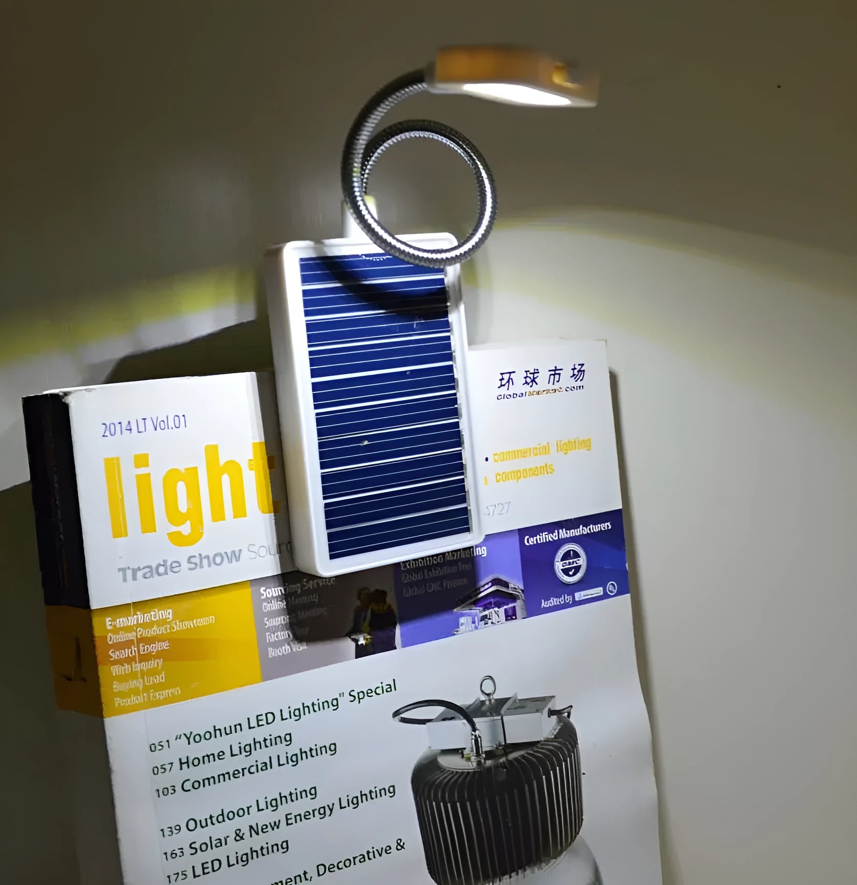 White solar garden lamp with plastic shade and integrated solar panel for outdoor decorative lighting.