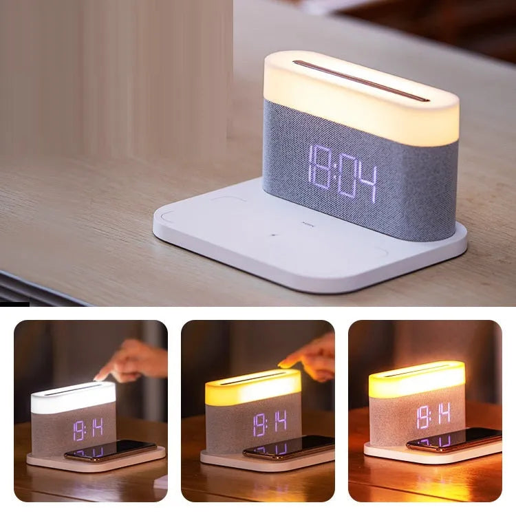Black and white multifunctional table lamp with integrated digital clock and wireless phone charging pad