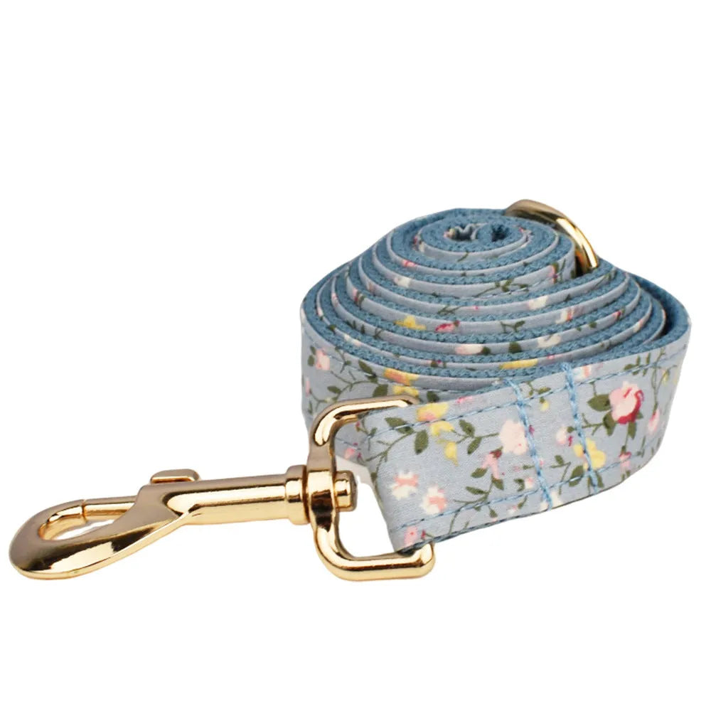 Blue floral polyester cotton dog collar set with matching leash, bow, vest and waste bag holder accessories
