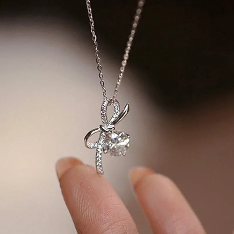 Bow necklace for women in XL1511 White Gold with inlaid zircon, copper base, and O-ring chain, 21-50cm.