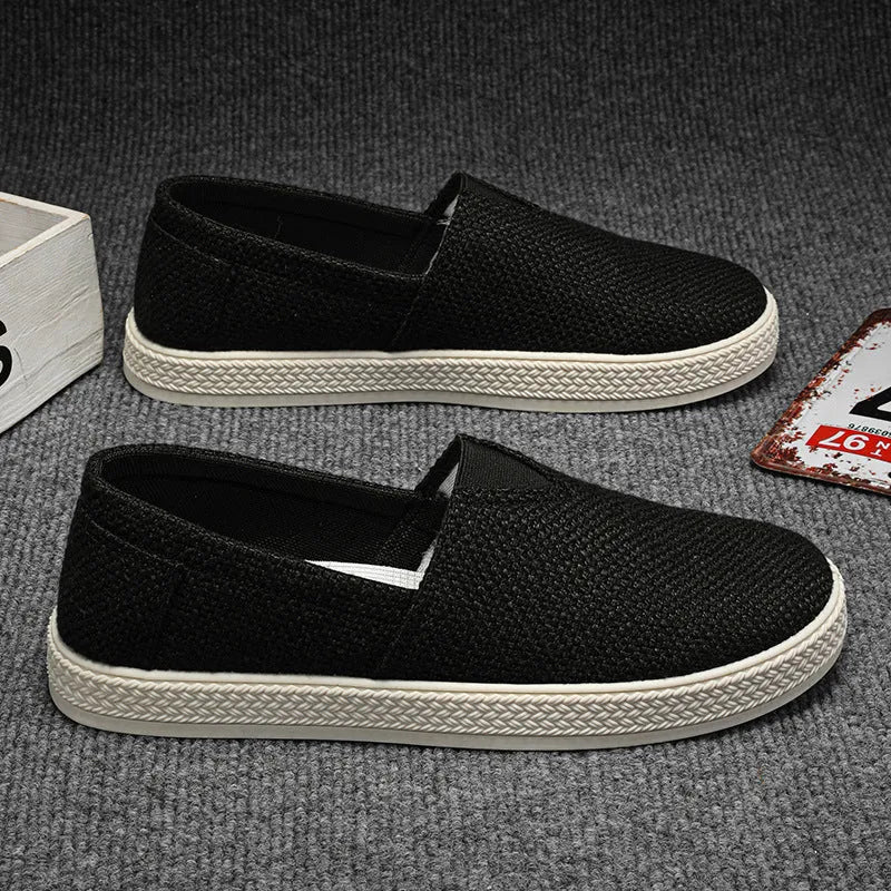 Men's linen-style cloth shoes in canvas with PVC soles showing round toe and sewing thread details