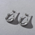 Copper plating 18K real gold irregular lines geometric needle ear studs on white background