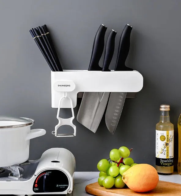 White plastic kitchen knife rack with modern simple design on a countertop