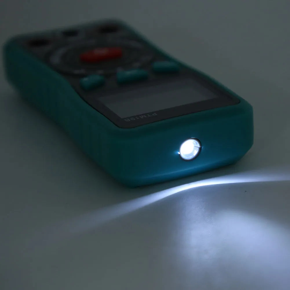 Green PTM automatic digital multimeter with LED display on a workbench