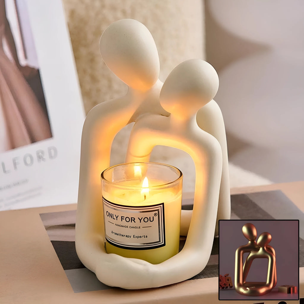 A modern style loving couple resin statue in either milky white or gold finish.