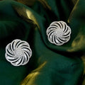 Copper geometric line flower design earrings with inlaid zircon in white gold colour on a neutral background
