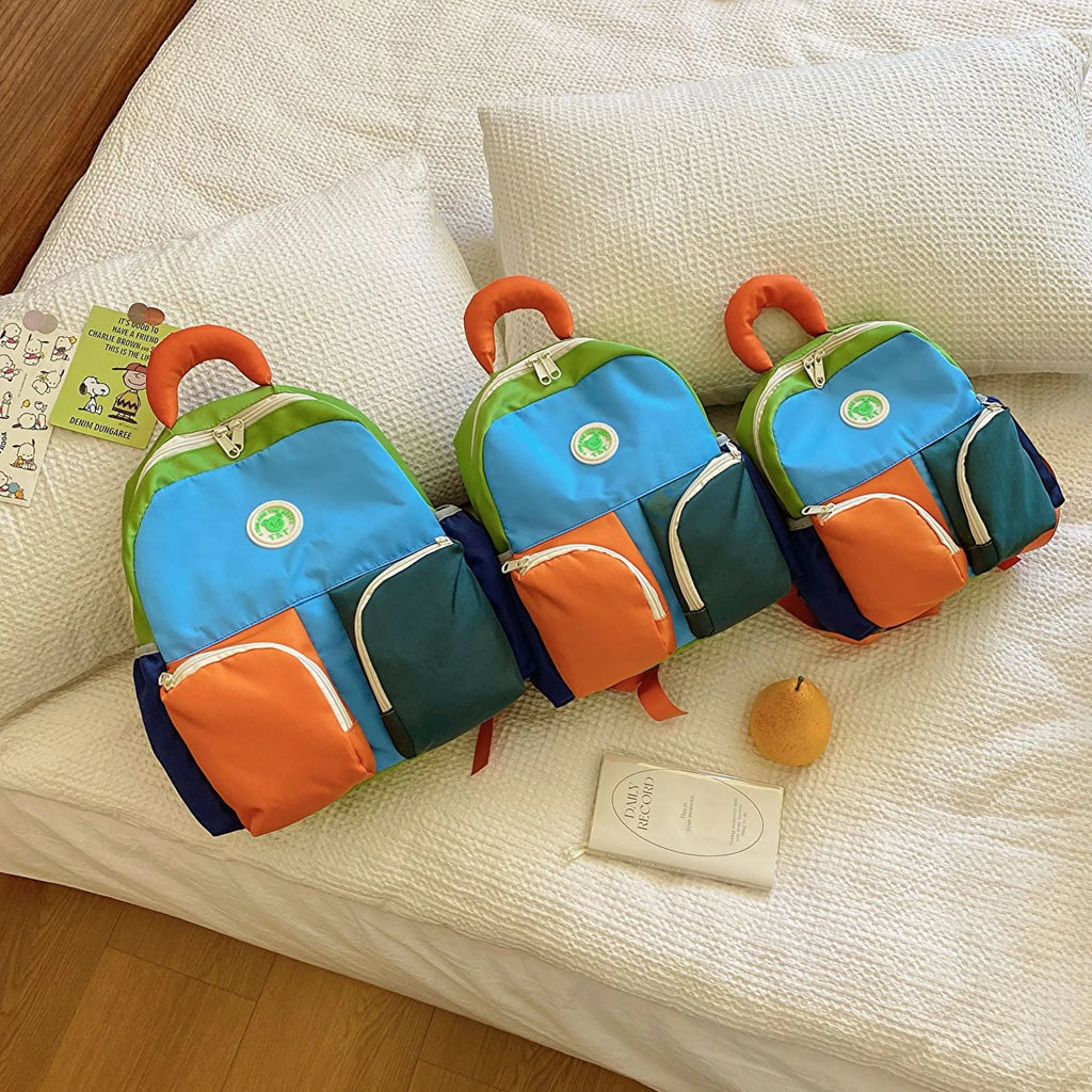 Children's trendy backpack in solid colour, lightweight Oxford cloth, blue pink yellow sizes small medium large