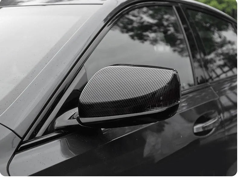 Set of ABS plastic mirror covers for Cadillac CT5 CT6 in carbon fibre, silver, and rain frame styles.