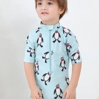 Boy's long sleeve penguin print swimsuit two-piece set with matching swimming cap