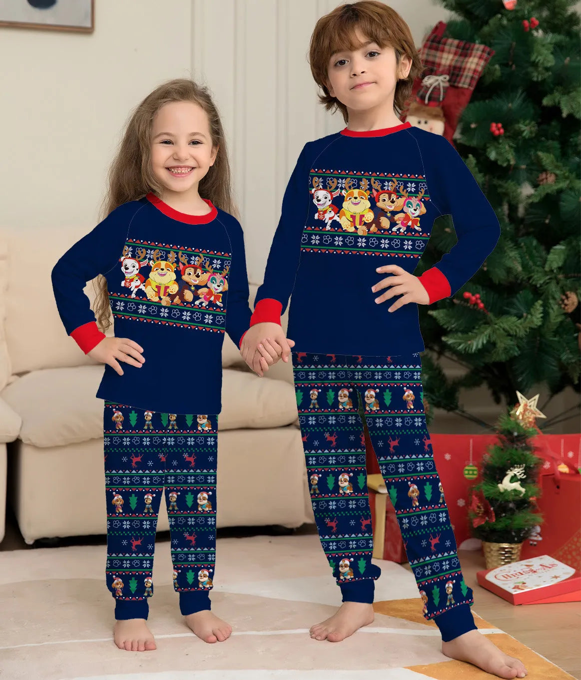 Matching red plaid Christmas pyjamas with cartoon deer print for men, women, children, babies, and dogs.