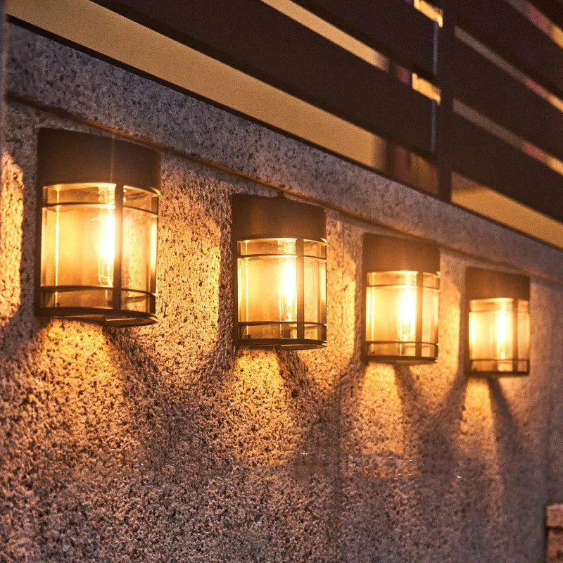 Solar-powered outdoor wall light with waterproof housing and warm white illumination