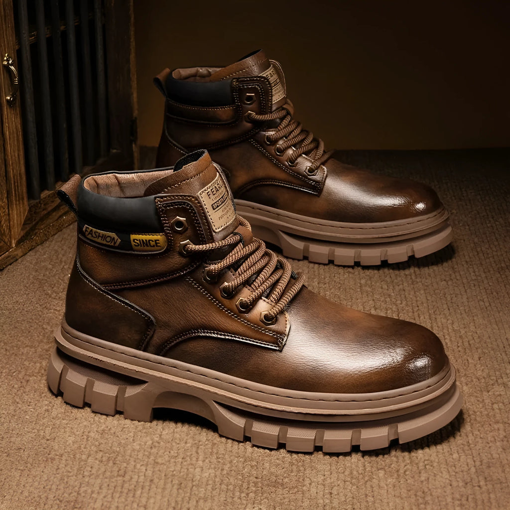 Men's brown Martin boots with high-top design, lace-up front, and round toe on rubber sole