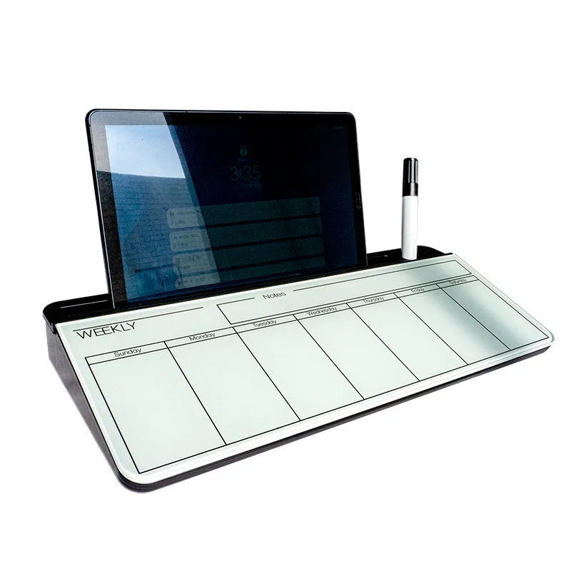 Glass whiteboard 18x40cm with black frame and marker on desk