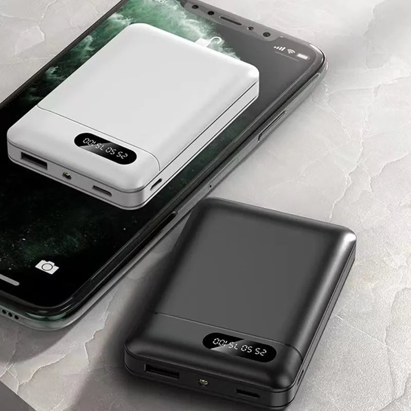 White or black plastic portable power bank with USB ports showing dimensions 92mm x 63mm x 23mm