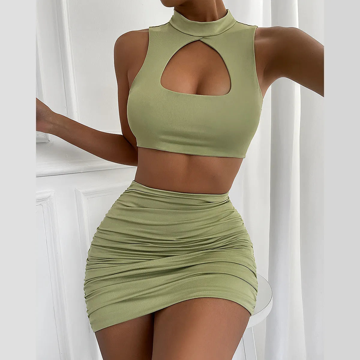 Light purple women's two-piece set with hollow vest top and split skirt on model